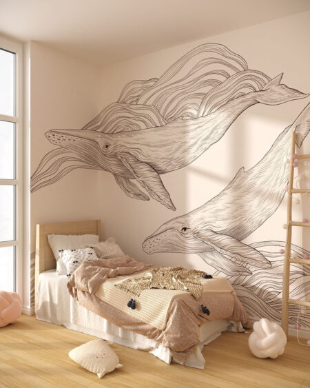 Dwa czarno-białe wieloryby na ścianie w pokoju dziecięcym