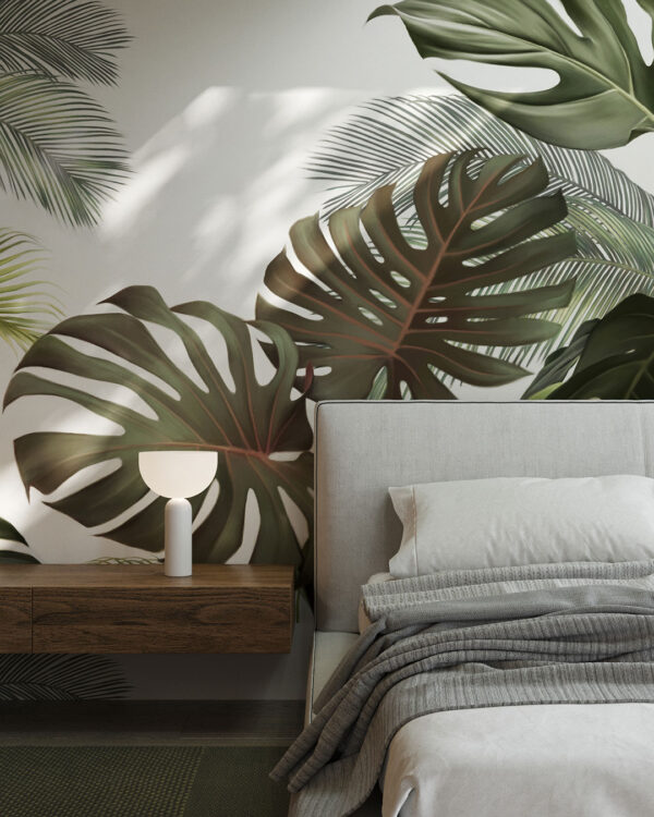 Fototapeta duże tropikalne liście monstery i palmy na jasnym tle do sypialni
